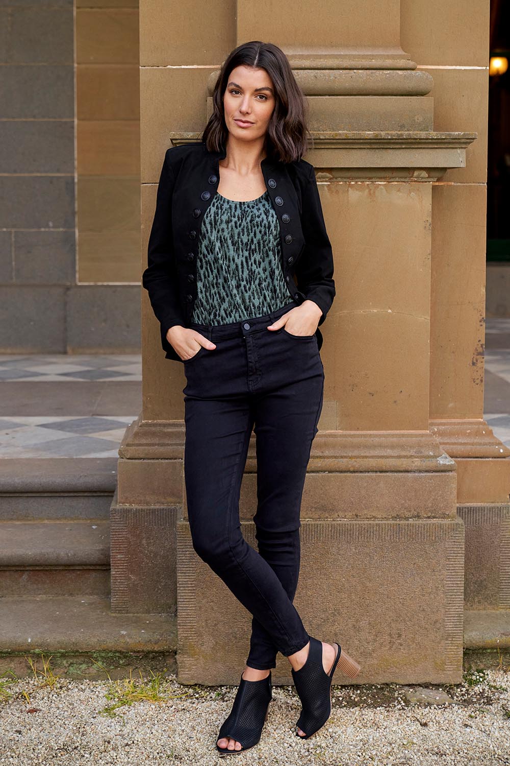 A model wearing the Betty Essential Jean in colour Black (Black), from the front, showing the whole outfit