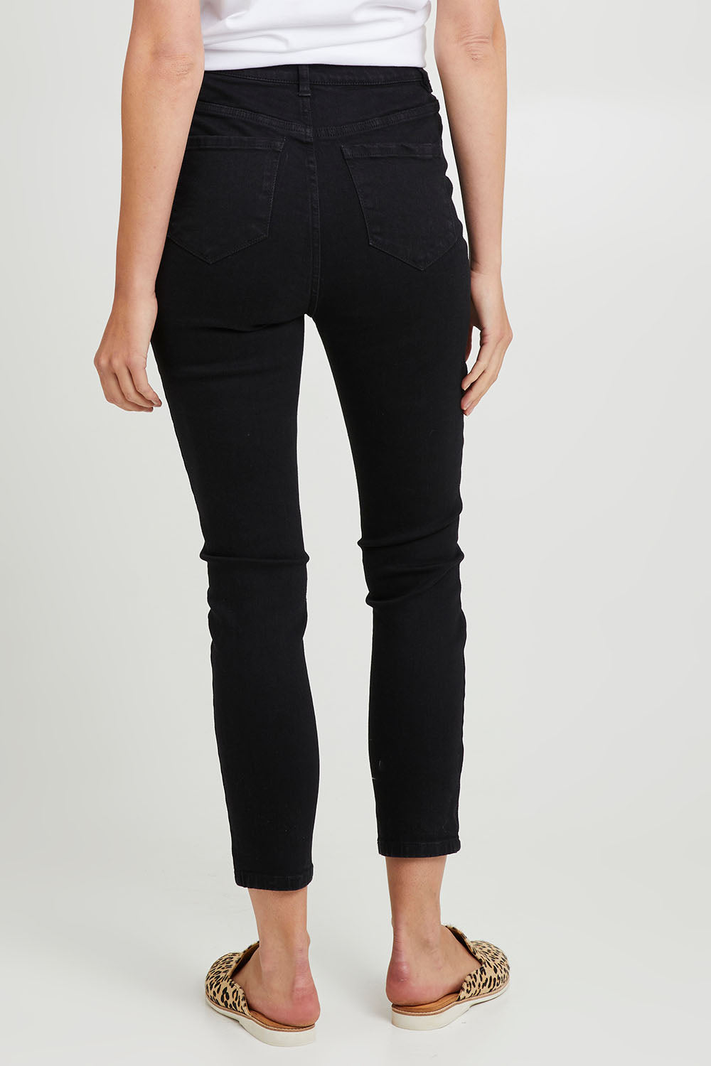 Model Madeline wearing size 10 of the Betty Essential Jean in colour Black (Black), from the back