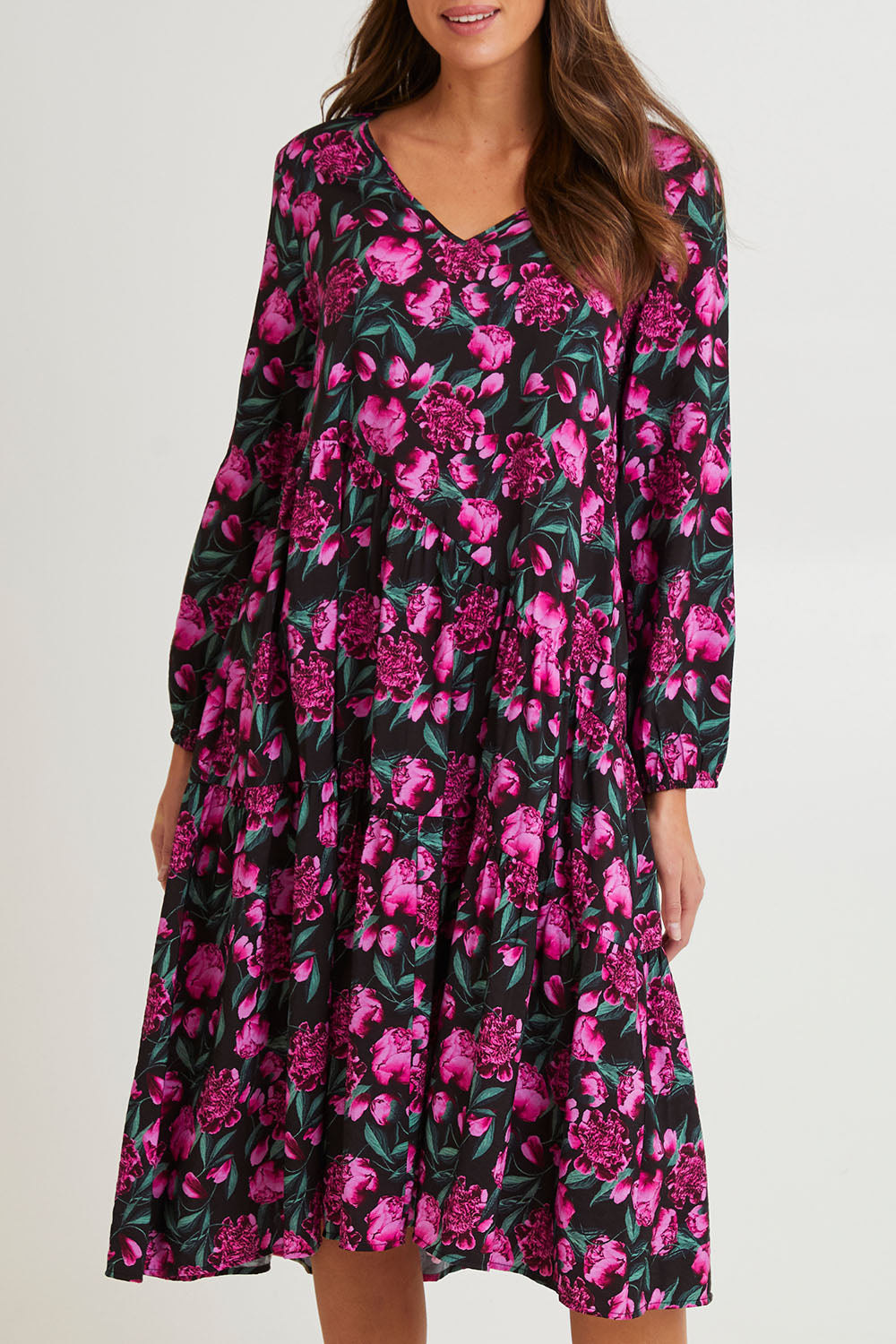 Model Madeline wearing size 10 of the Tenley Tiered Dress in colour Floral (Pink), from the front, cropped image