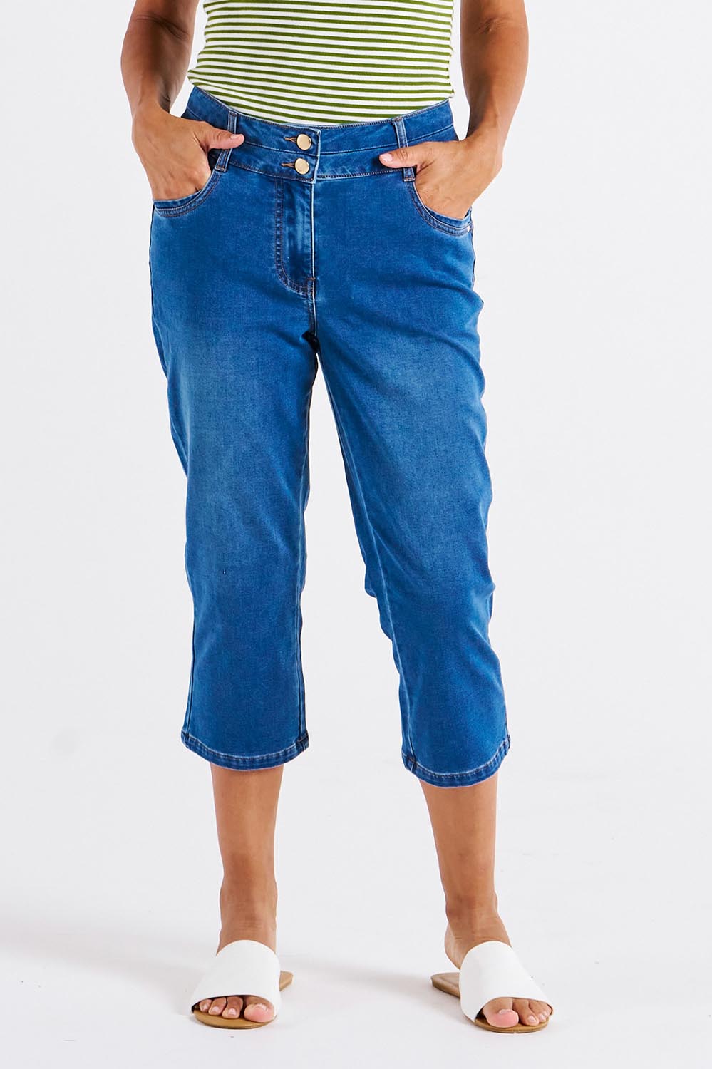 A model wearing the Alessi Crop Jean in colour Trueblue (Blue), from the front, cropped image