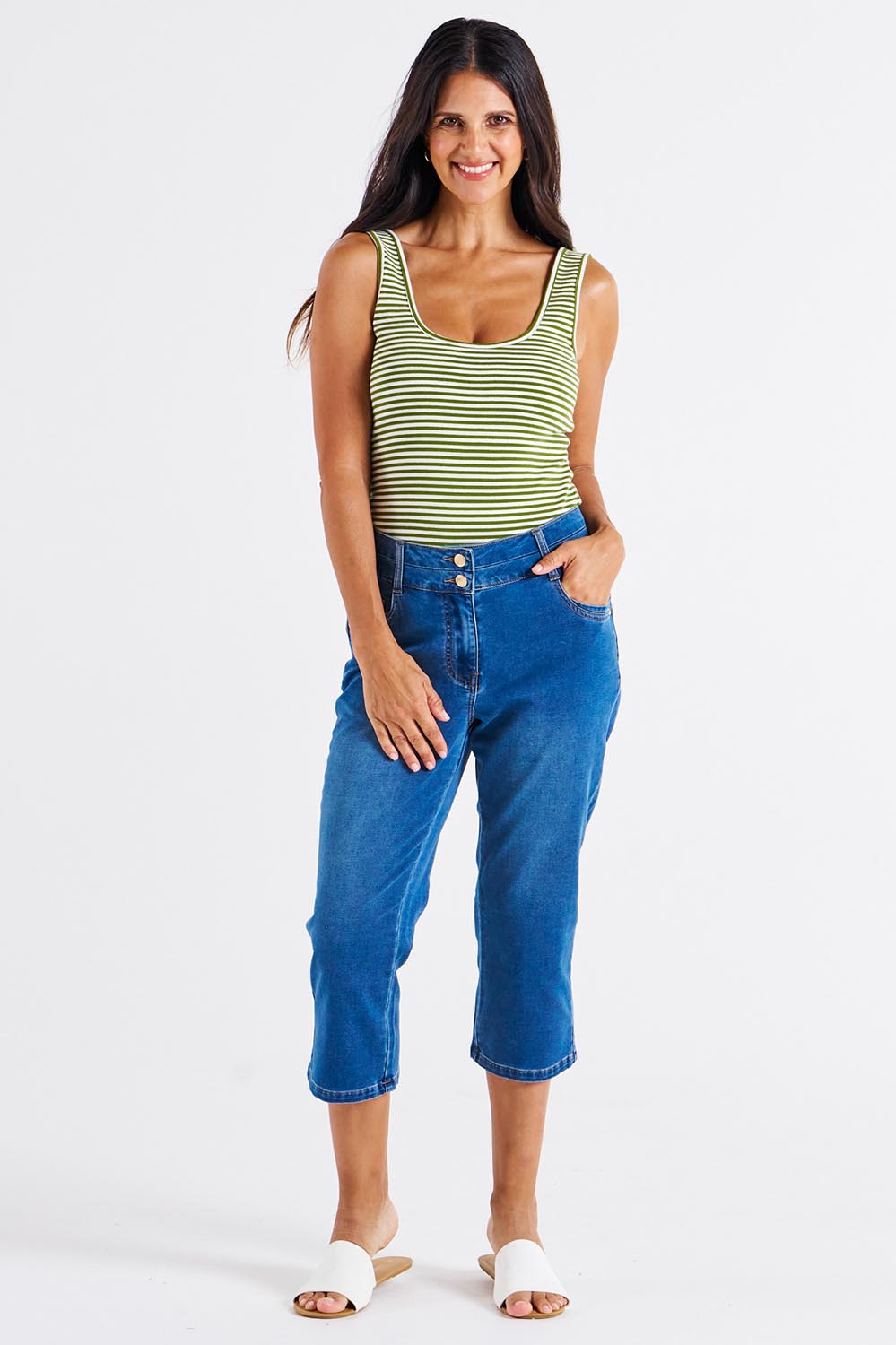 A model wearing the Alessi Crop Jean in colour Trueblue (Blue), from the front, showing the whole outfit