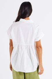 A model wearing the Mara Cotton Shirt in colour White (White), from the back