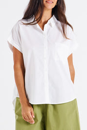 A model wearing the Mara Cotton Shirt in colour White (White), from the front, cropped image