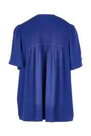 Product shot of the Sandy Shirred Blouse in colour Blue (Blue), from the back