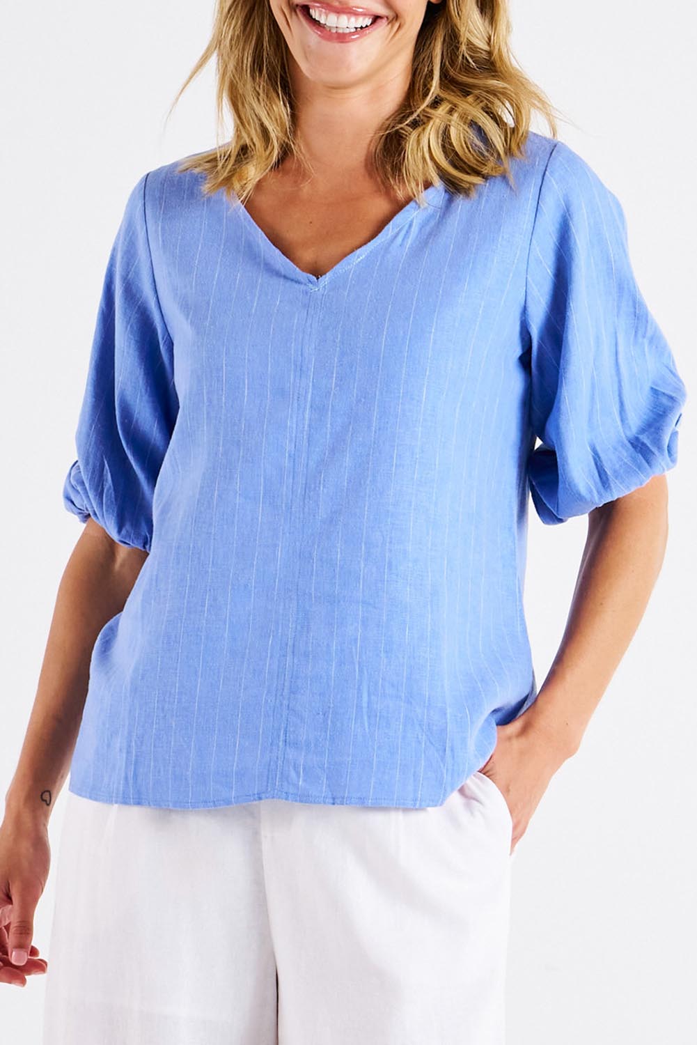A model wearing the Elanora Linen Blend Blouse in colour Berryblue (Blue), from the front, cropped image
