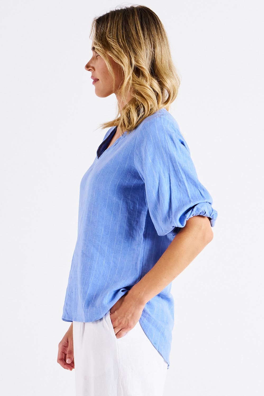 A model wearing the Elanora Linen Blend Blouse in colour Berryblue (Blue), from the front, cropped image