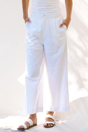 A model wearing the Aspen Linen Blend Palazzo Pant in colour White (White), from the front, cropped image