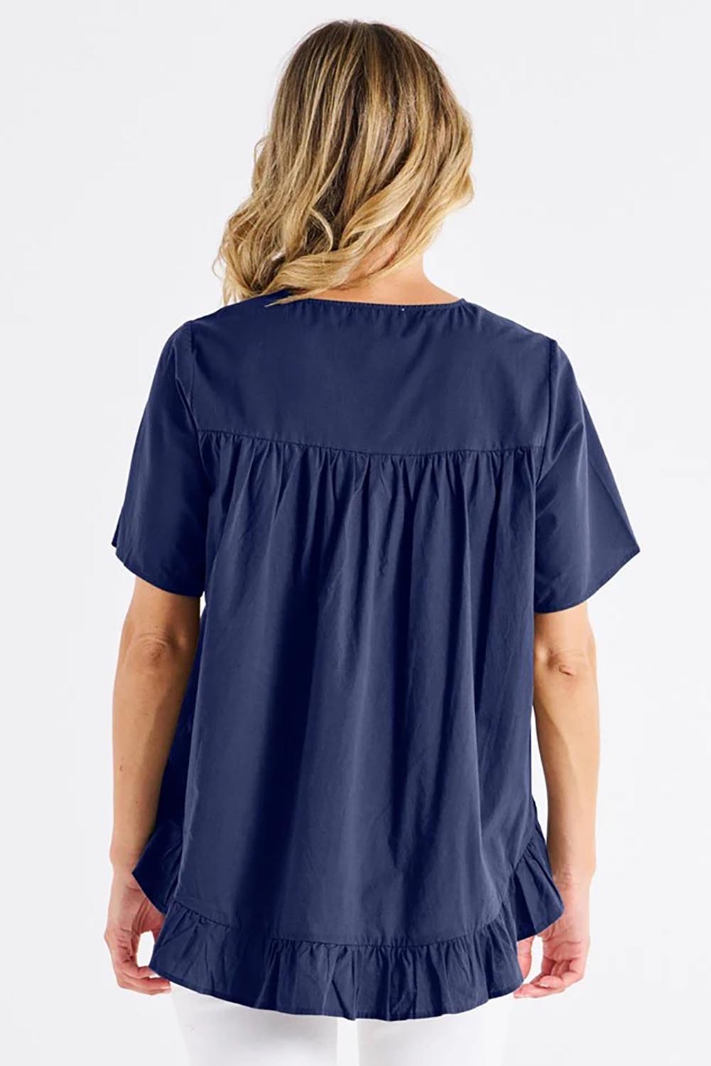 A model wearing the Candice Cotton Blouse in colour Frenchblue (Blue), from the back