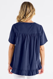 A model wearing the Candice Cotton Blouse in colour Frenchblue (Blue), from the back