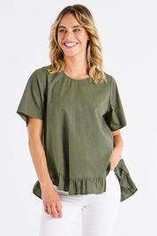 A model wearing the Candice Cotton Blouse in colour Olivbranch (Green), from the front, cropped image