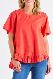 A model wearing the Candice Cotton Blouse in colour Watermelon, from the front, cropped image