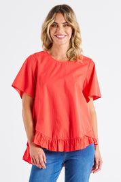 A model wearing the Candice Cotton Blouse in colour Watermelon, from the front, cropped image