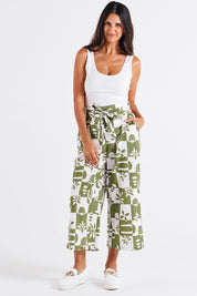 A model wearing the Cabo Cotton Crop Pant in colour Geofloral (Green), from the front, showing the whole outfit