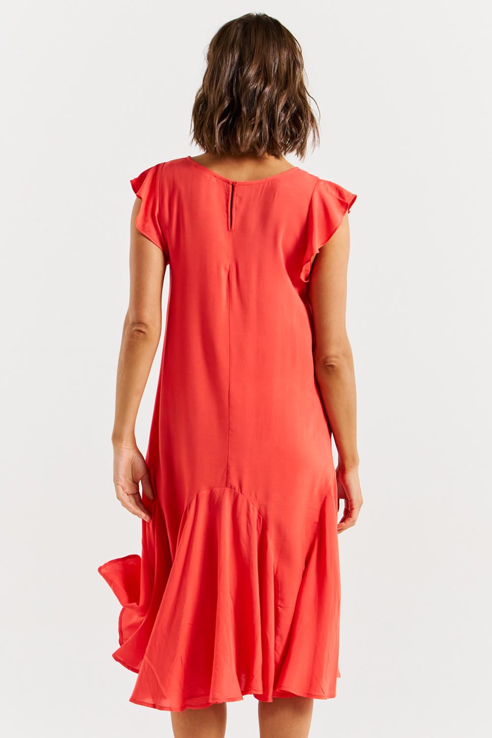 A model wearing the Hannah Dress in colour Fiestared (Red), from the back