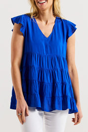 A model wearing the Danica Frill Top in colour Cobalt (Blue), from the front, cropped image