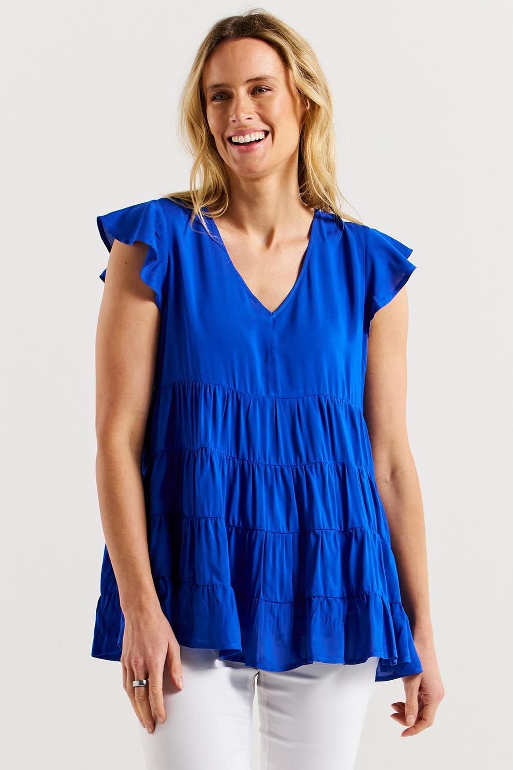 A model wearing the Danica Frill Top in colour Cobalt (Blue), from the front, cropped image