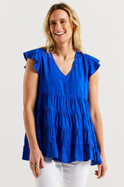 A model wearing the Danica Frill Top in colour Cobalt (Blue), from the front, cropped image