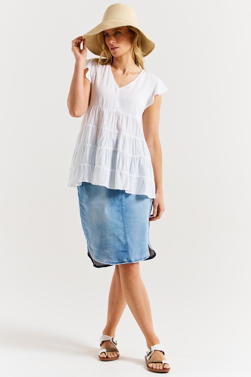 A model wearing the Danica Frill Top in colour White (White), from the front, showing the whole outfit