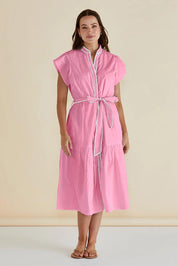 A model wearing the Mari Cotton Dress in colour Blush (Pink), from the front, cropped image