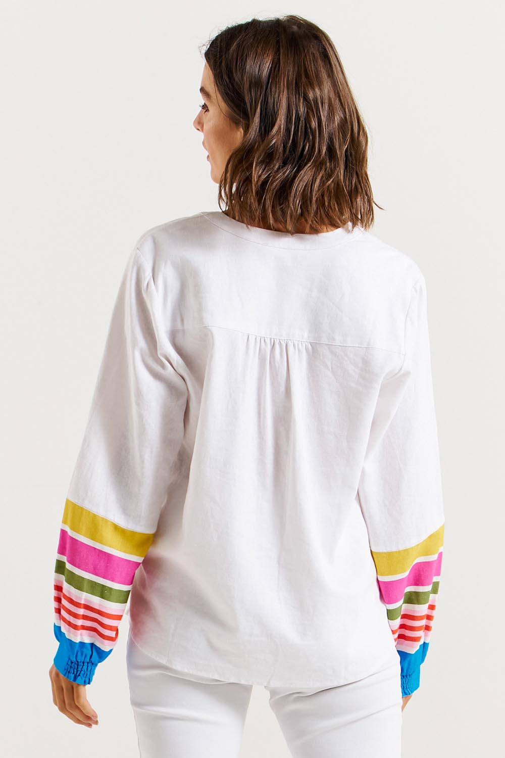 A model wearing the Blossom Linen Blend Blouse in colour White (White), from the back