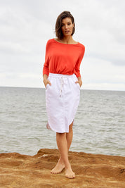 A model wearing the Alina Denim Skirt in colour White (White), from the front, showing the whole outfit