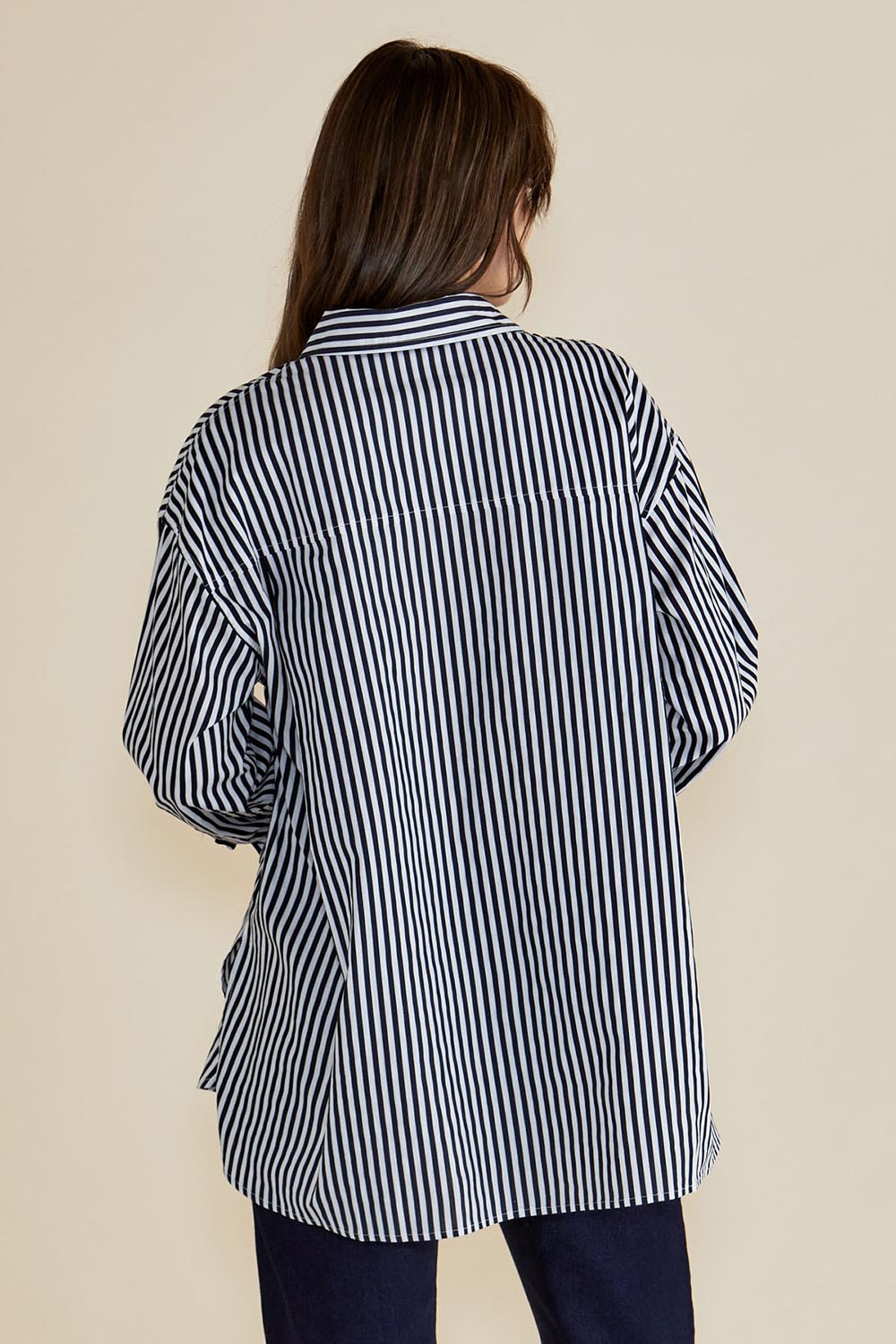 A model wearing the Claire Classic Cotton Shirt in colour Navystripe (Blue), from the back