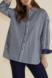 A model wearing the Claire Classic Cotton Shirt in colour Navystripe (Blue), from the front, cropped image