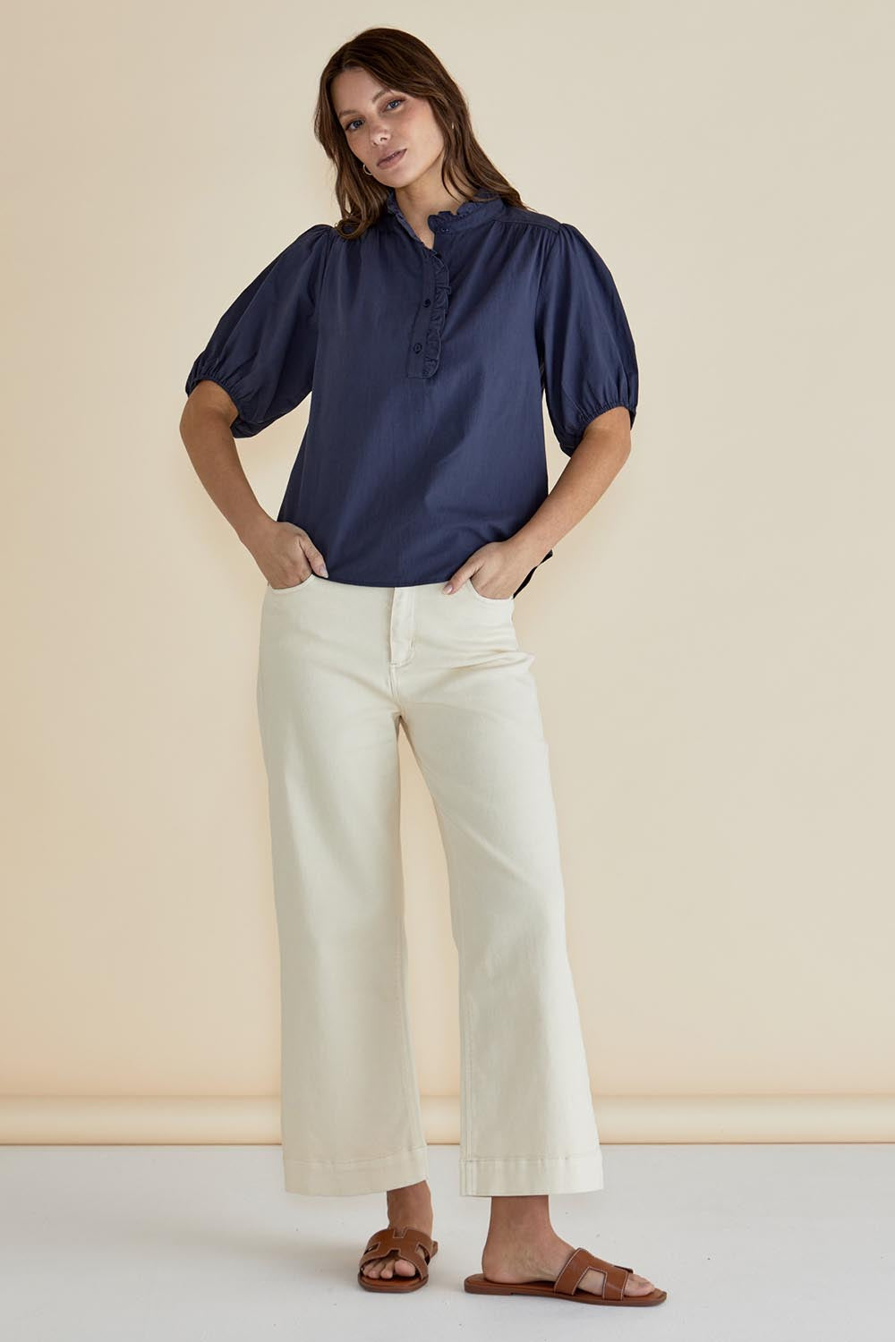 A model wearing the Avery Cotton Blouse in colour Frechblue (Blue), from the front, showing the whole outfit
