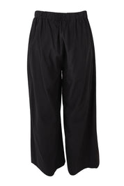 Product shot of the Wendy Wide Leg Cotton Pant in colour Black (Black), from the back