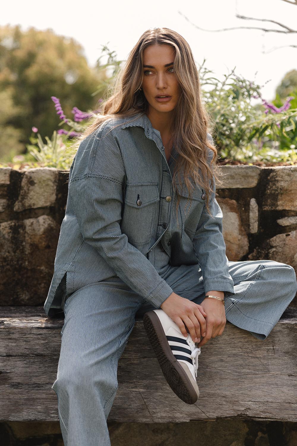 A model wearing the Willow Wide Leg Jean in colour Pinstripe (Blue), from the front, showing the whole outfit