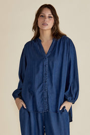 A model wearing the London Lyocell Blouse in colour Darkindigo (Blue), from the front, cropped image