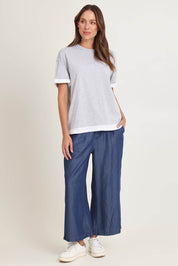 Model Madeline wearing size 10 of the Rio Lyocell Relaxed Pant in colour Darkblue (Blue), from the front, showing the whole outfit