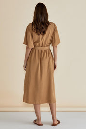 A model wearing the Dresden Lyocell Dress in colour Tan, from the back