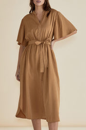 A model wearing the Dresden Lyocell Dress in colour Tan, from the front, cropped image