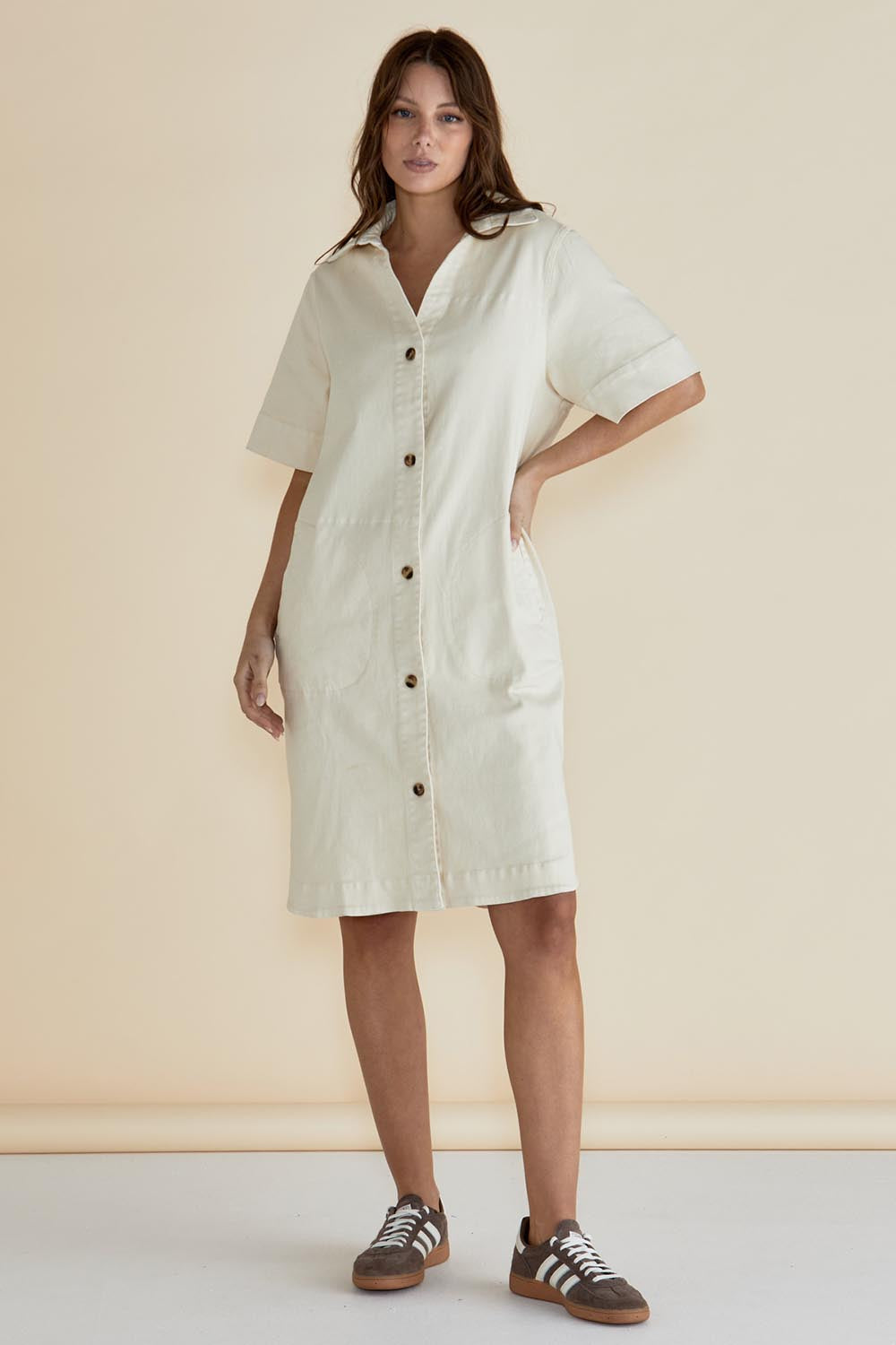 A model wearing the Dawson Denim Dress in colour Offwhite (White), from the front, showing the whole outfit