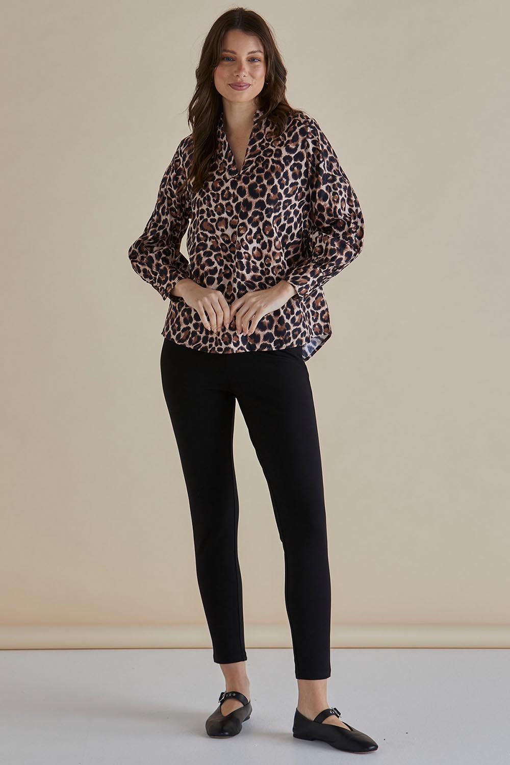 A model wearing the Pinot Cotton Blouse in colour Leopard, from the front, showing the whole outfit