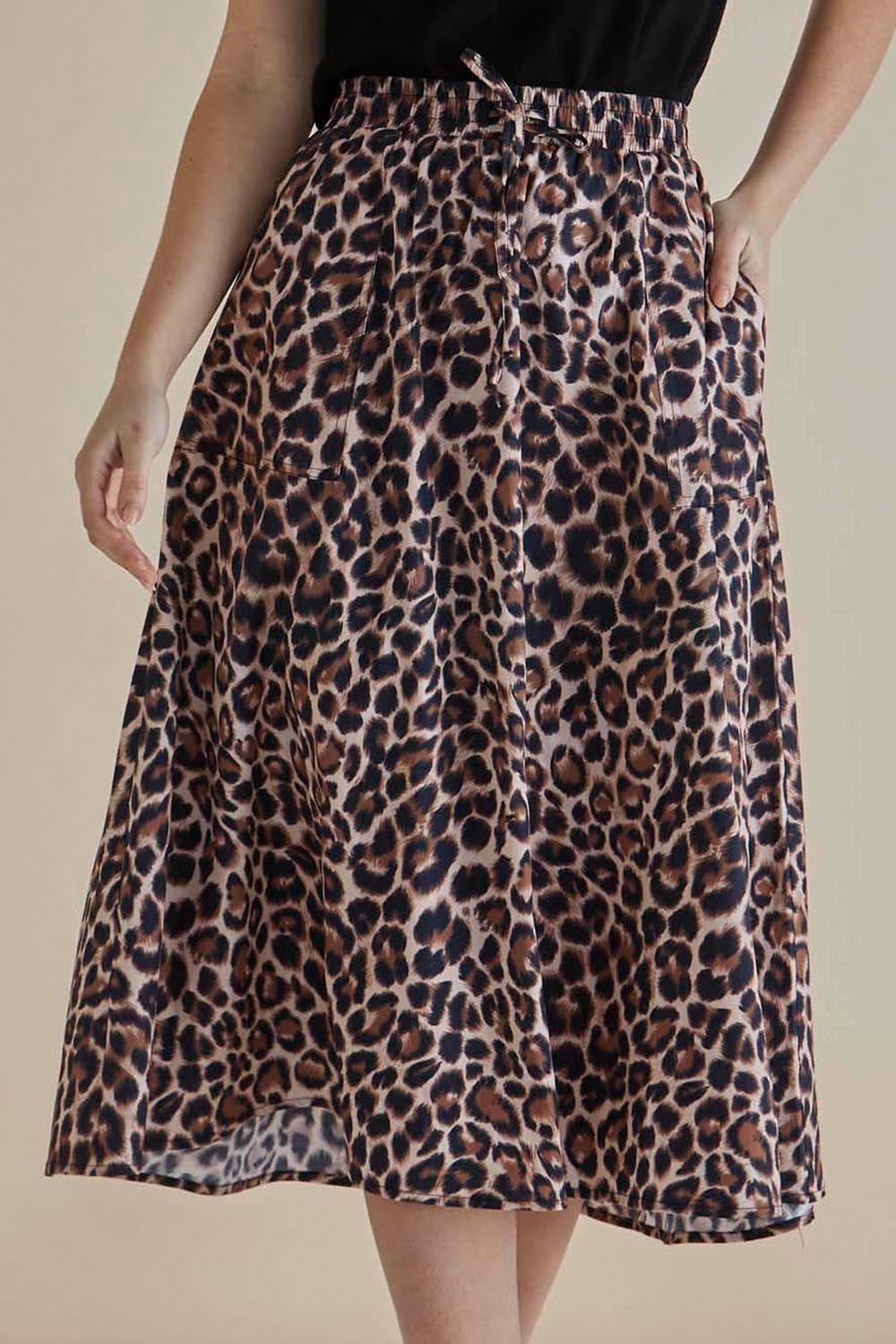 A model wearing the Sirah Cotton Skirt in colour Leopard, from the front, cropped image