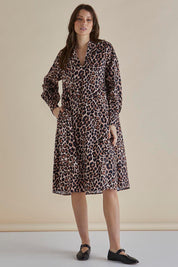 A model wearing the Chardonnay Cotton Dress in colour Leopard, from the front, showing the whole outfit