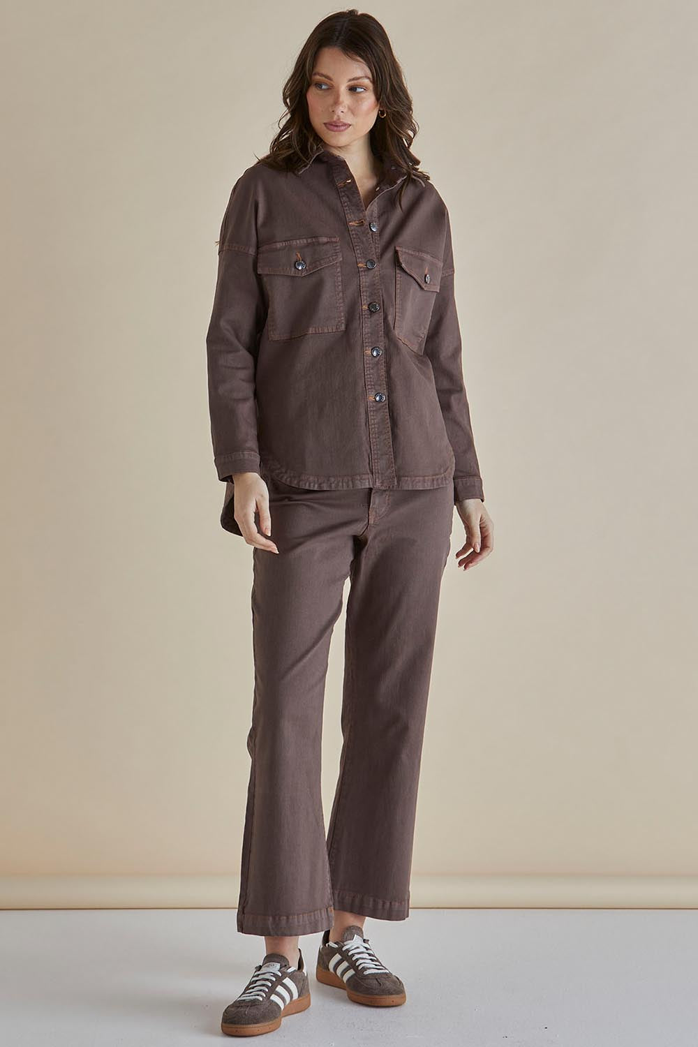 A model wearing the Cherry Denim Shirt in colour Coco, from the front, showing the whole outfit