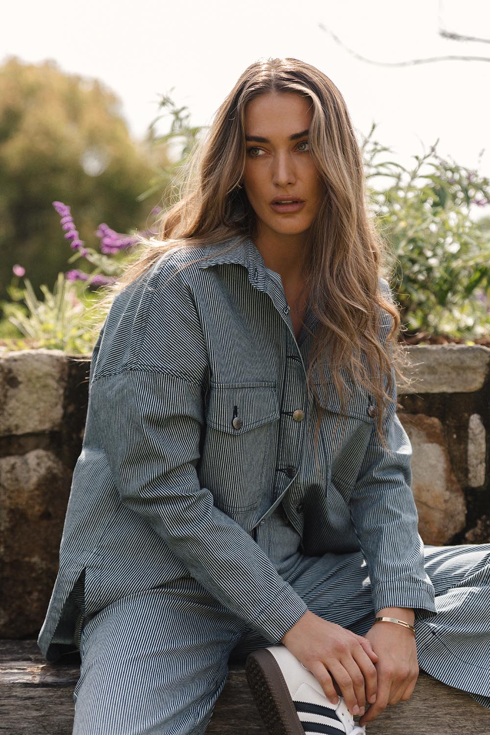 A model wearing the Cherry Denim Shirt in colour Pinstripe (Blue), from the front, showing the whole outfit