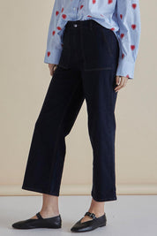 A model wearing the Easy Relax Jean in colour Bluesmoke (Blue), from the front, cropped image