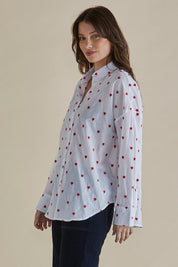A model wearing the Sage Cotton Shirt in colour Redheart (White), from the front, cropped image