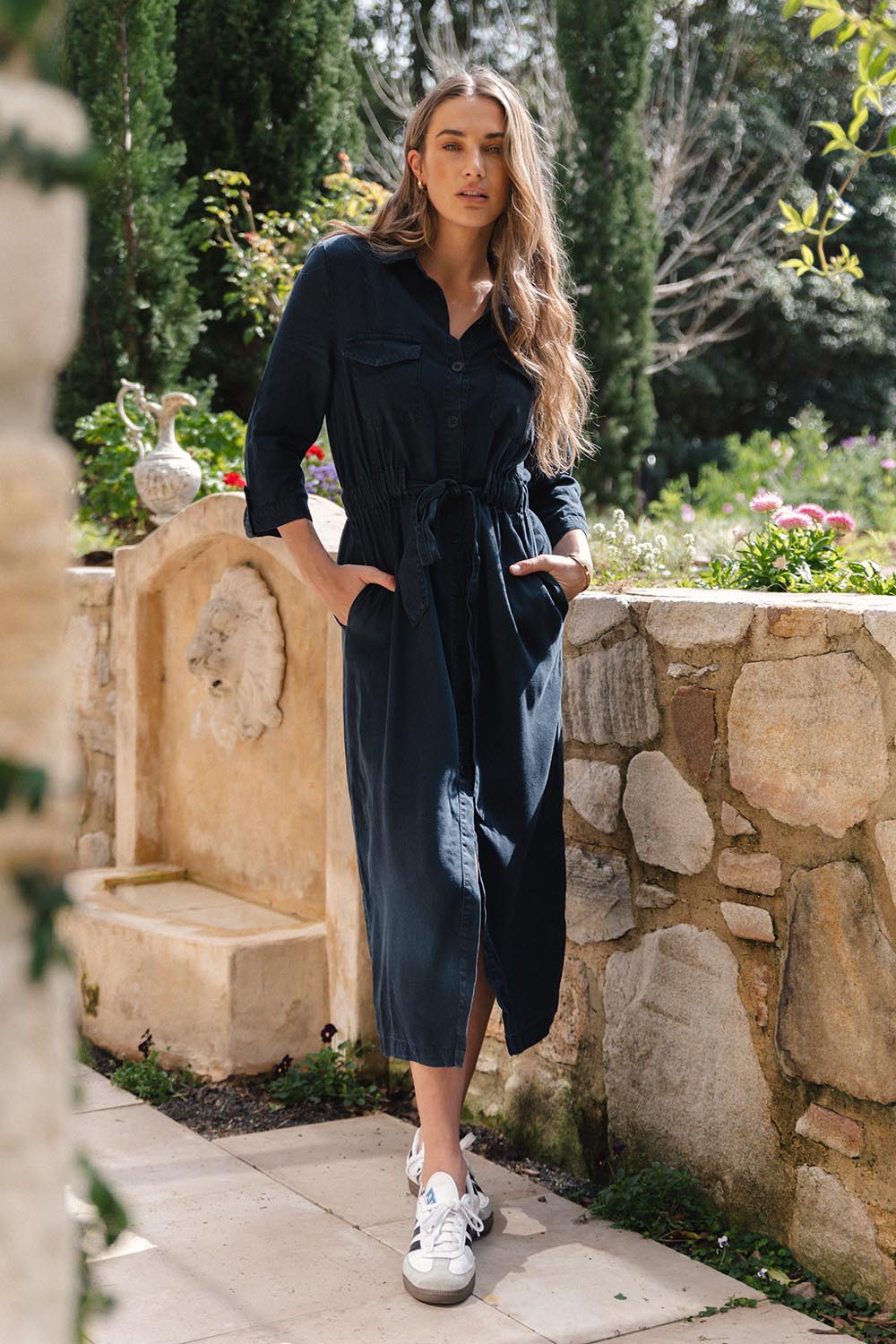 A model wearing the Betty Lyocell Shirt Dress in colour Bluevintag (Blue), from the front, showing the whole outfit