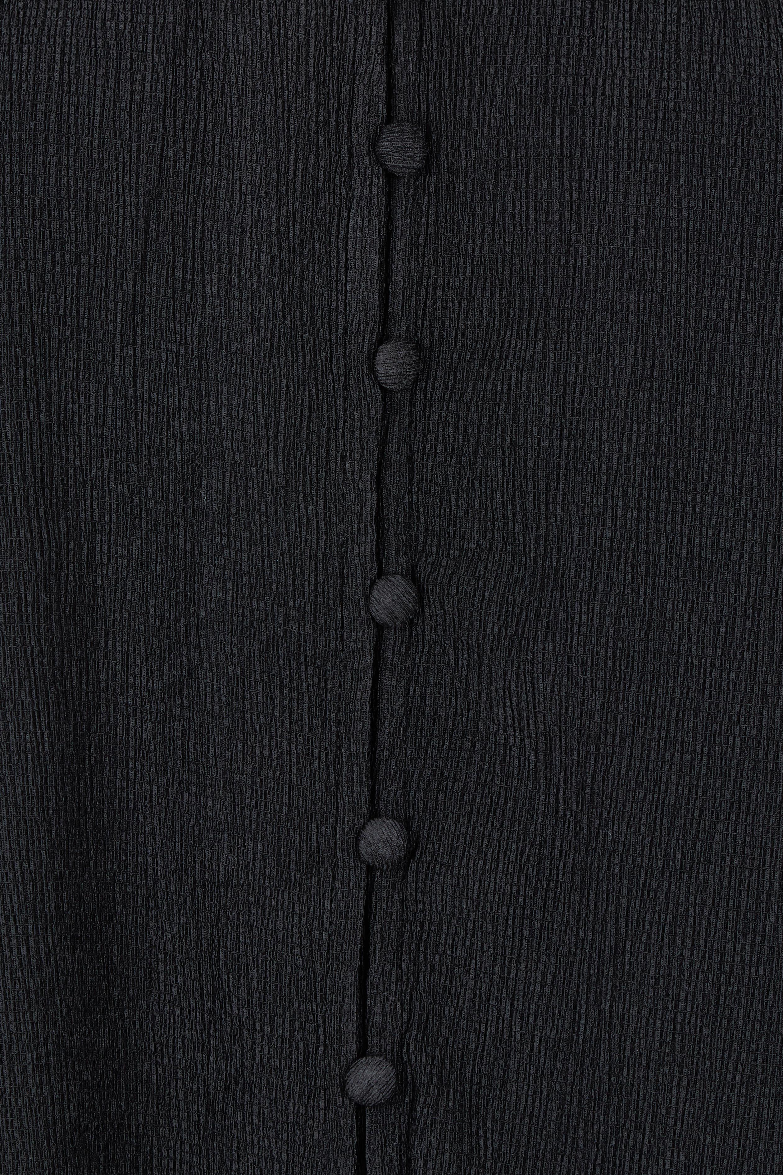 Product shot of the Marie Blouse in colour Black (Black), detail