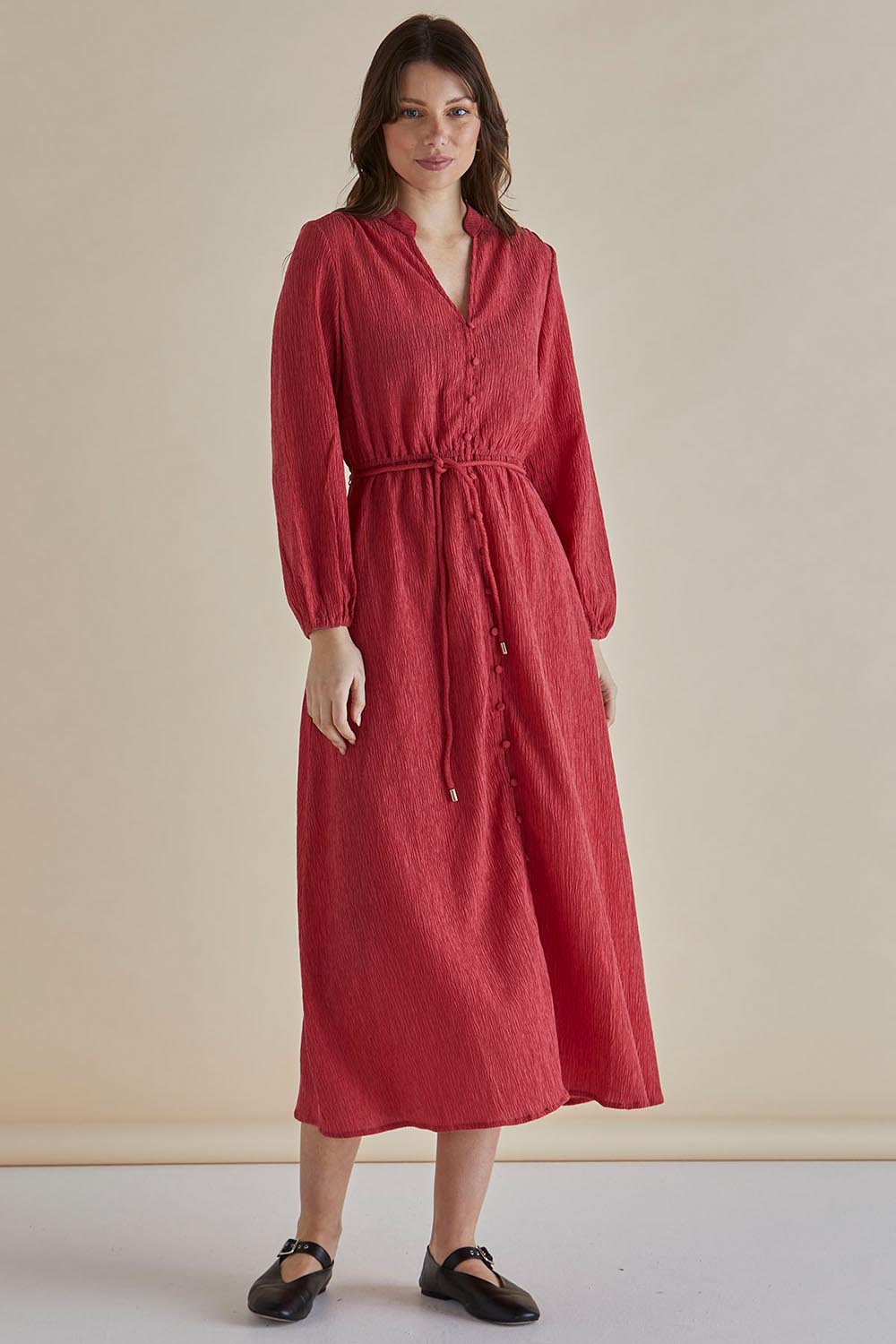 A model wearing the Anette Dress in colour Dustypink (Pink), from the front, showing the whole outfit