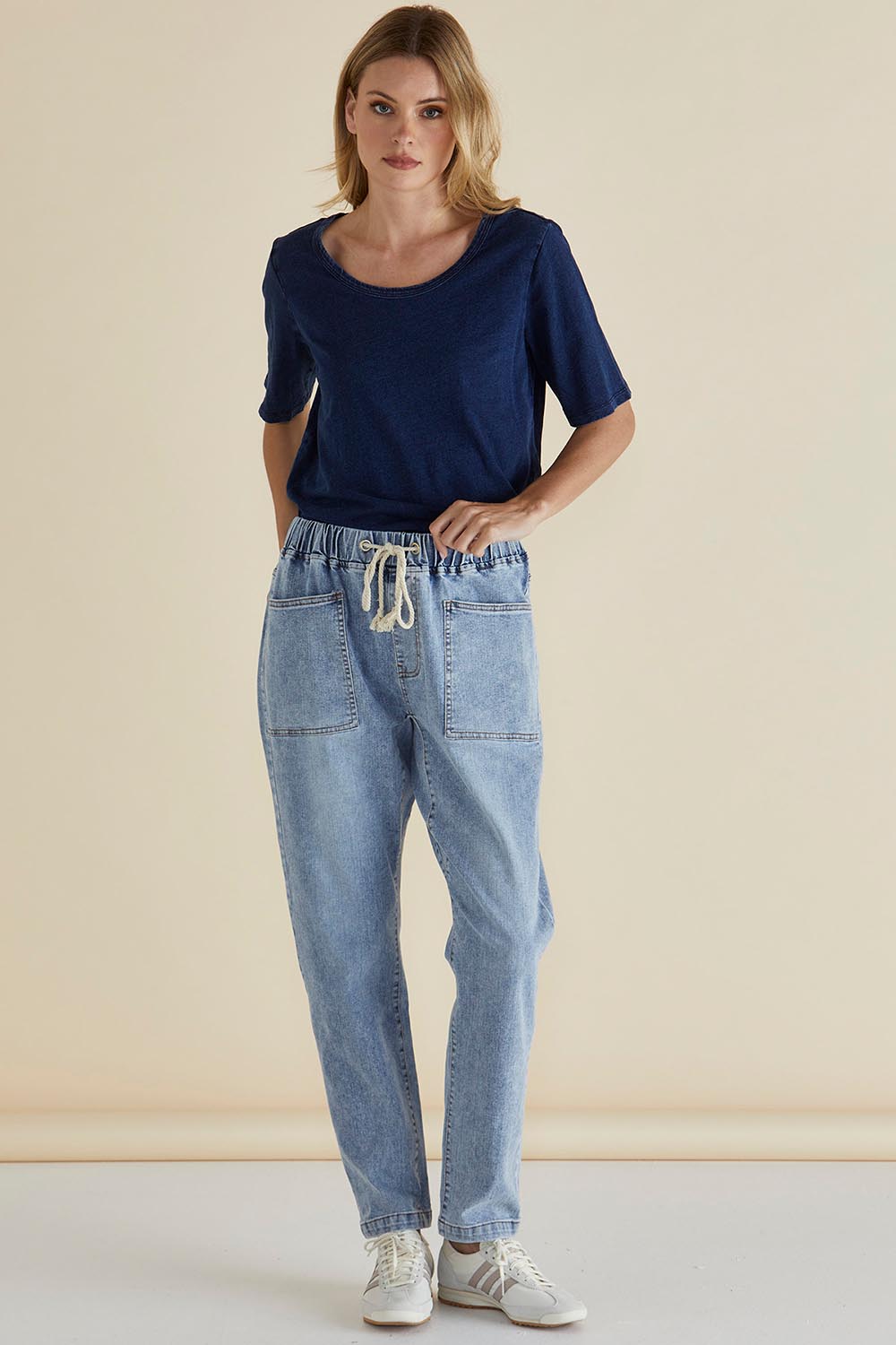 A model wearing the Haven Straight Leg Jean in colour Lightblue (Blue), from the front, showing the whole outfit