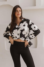 A model wearing the Rosie Shirt in colour Floral (Black), from the front, showing the whole outfit