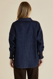 A model wearing the Sonderborg Denim Shirt in colour Darkink (Blue), from the back