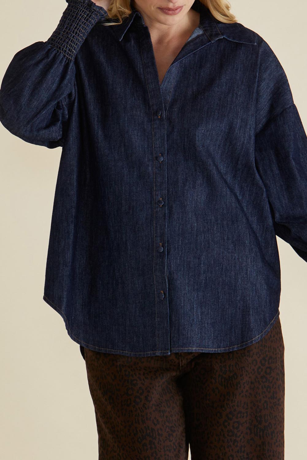 A model wearing the Sonderborg Denim Shirt in colour Darkink (Blue), from the front, cropped image