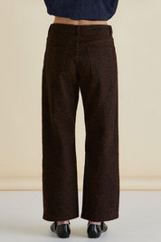 A model wearing the Steffie Relax Straight Leg Jean in colour Leopchoc, from the back